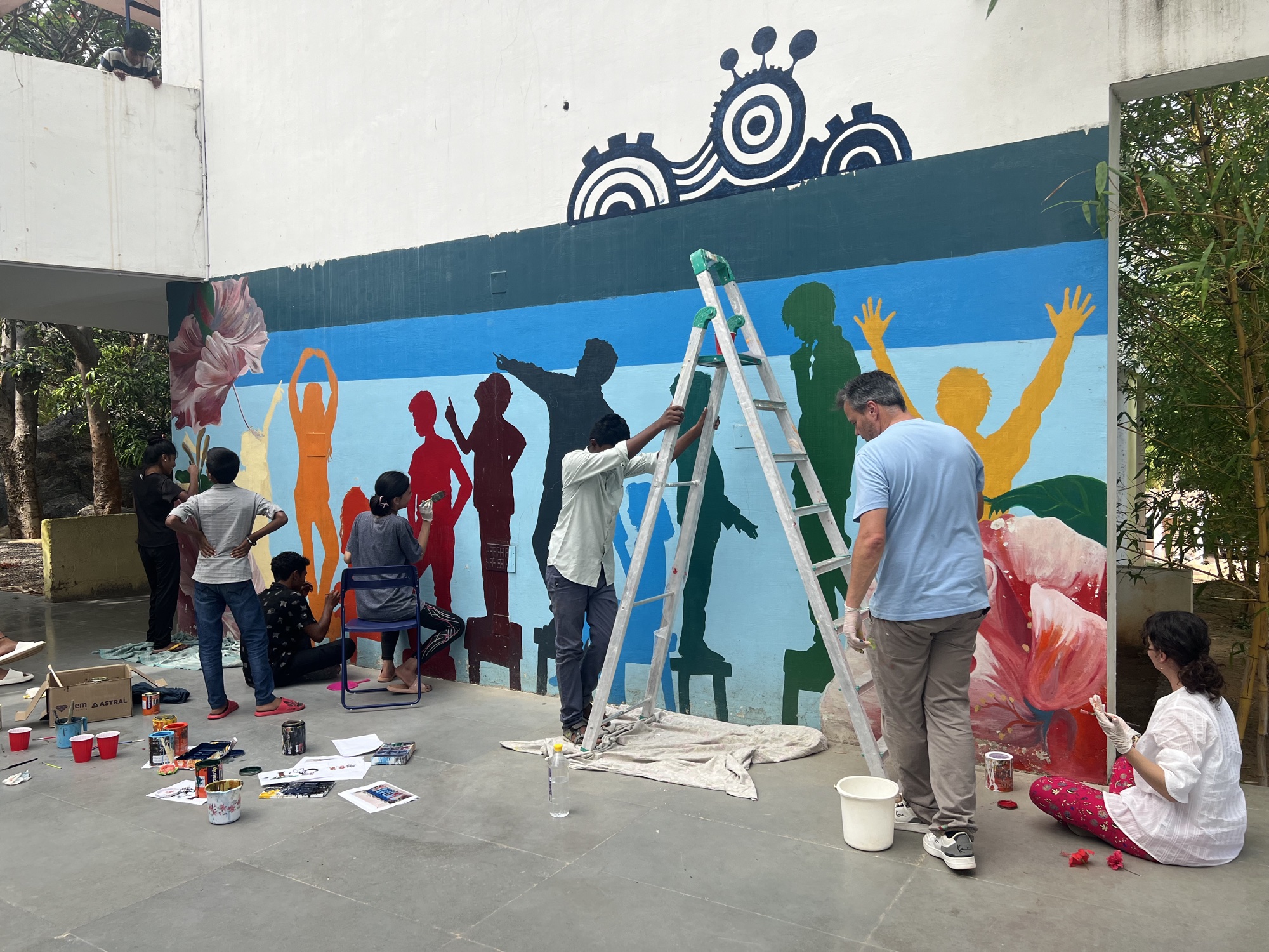 Sing for Hope students painting a mural together