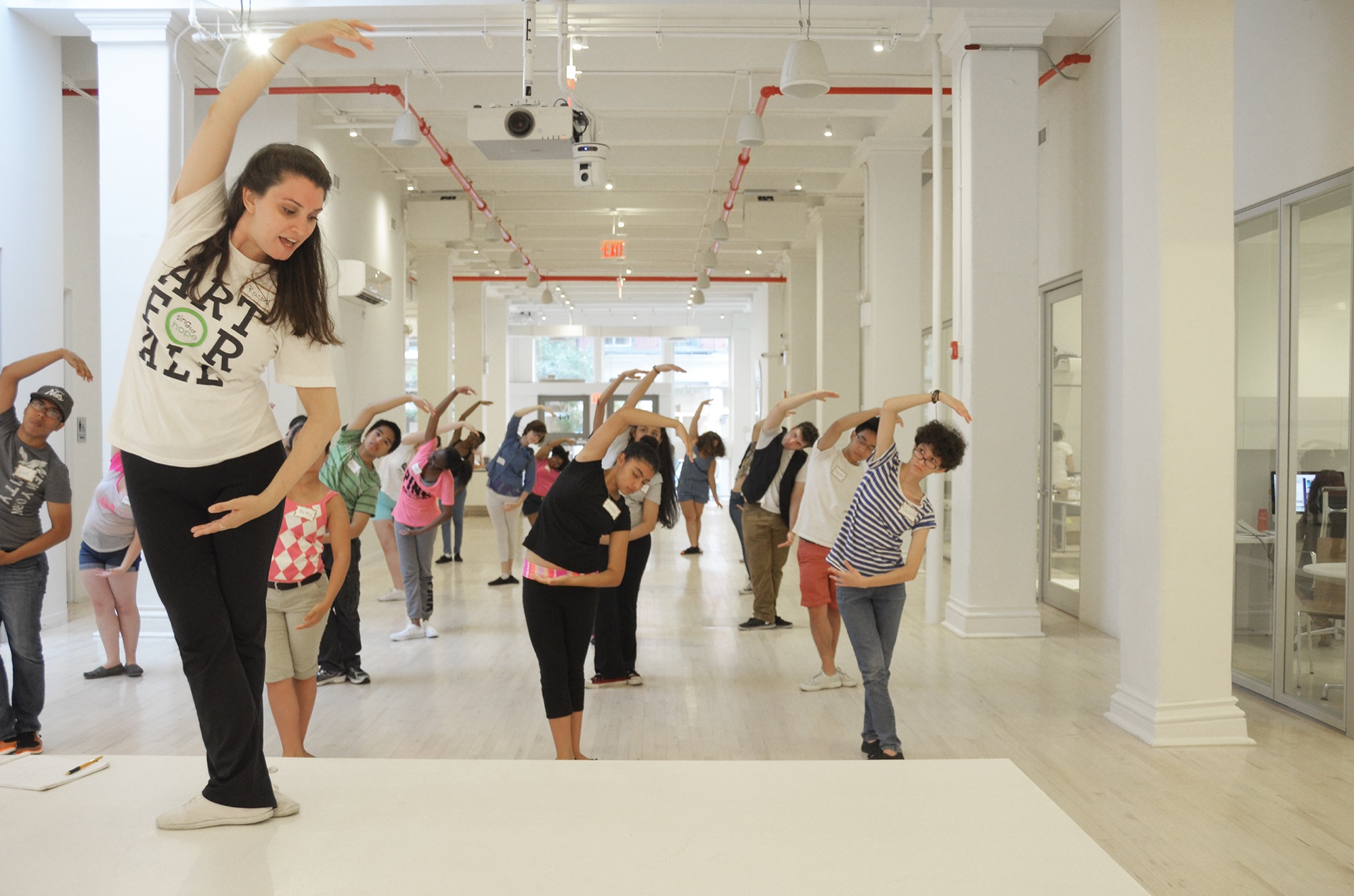 Sing for Hope students from the Bronx and Southern Westchester warm up in a ballet class