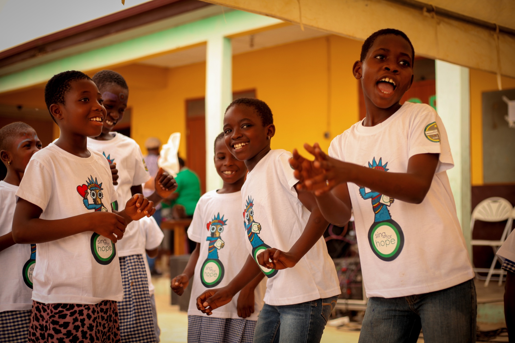 Sing for Hope students laughing during drama activity